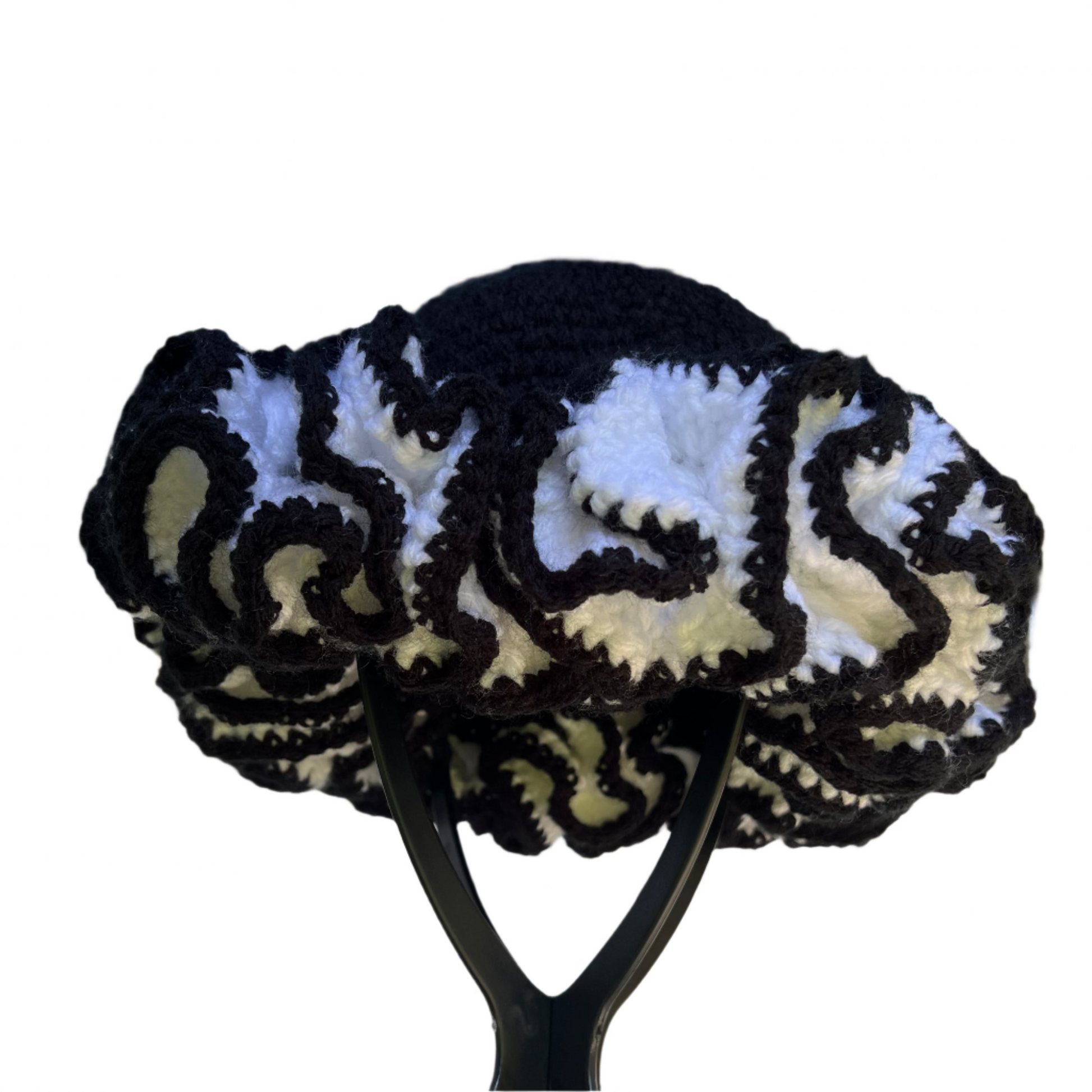 Black and white African crochet ruffle hat with intricate layered design by ThreadsByHannah