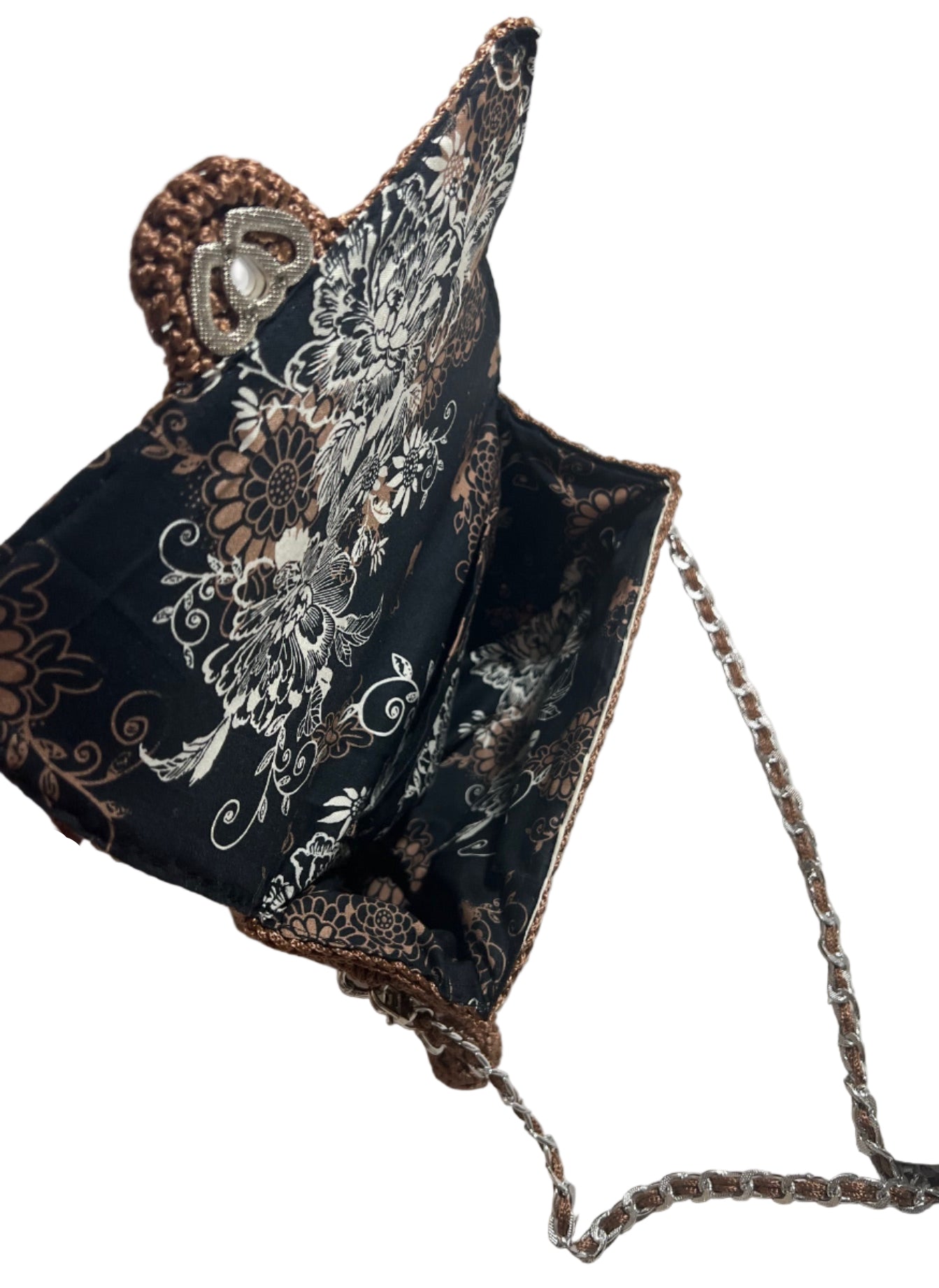 Artisan woven evening purse in black with floral design and silver chain strap for stylish occasions