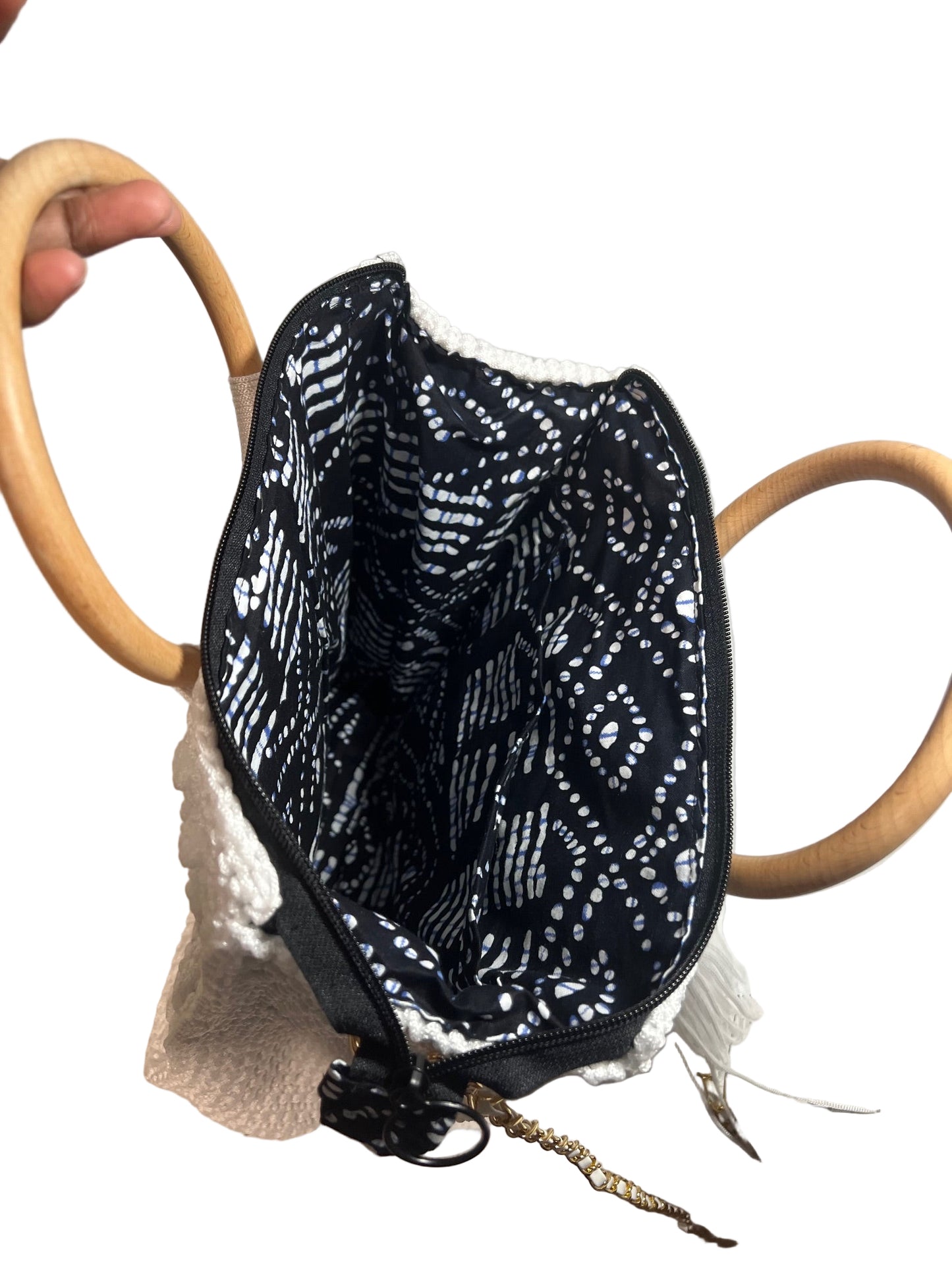 Interior view of a handcrafted trapezoid handbag featuring a stylish patterned lining