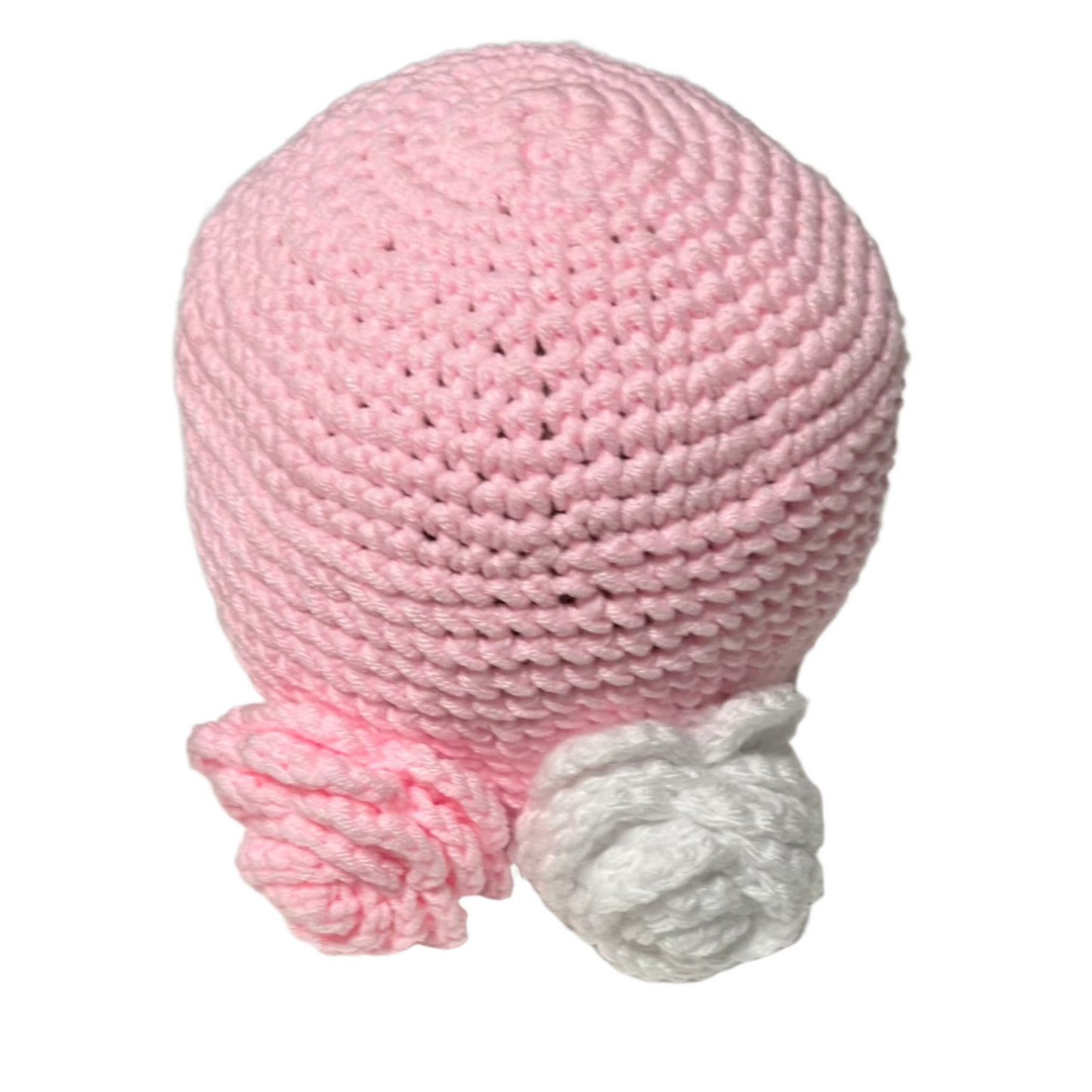 Pink handmade beanie for girls ages 4-10 with white and pink crochet flower accents