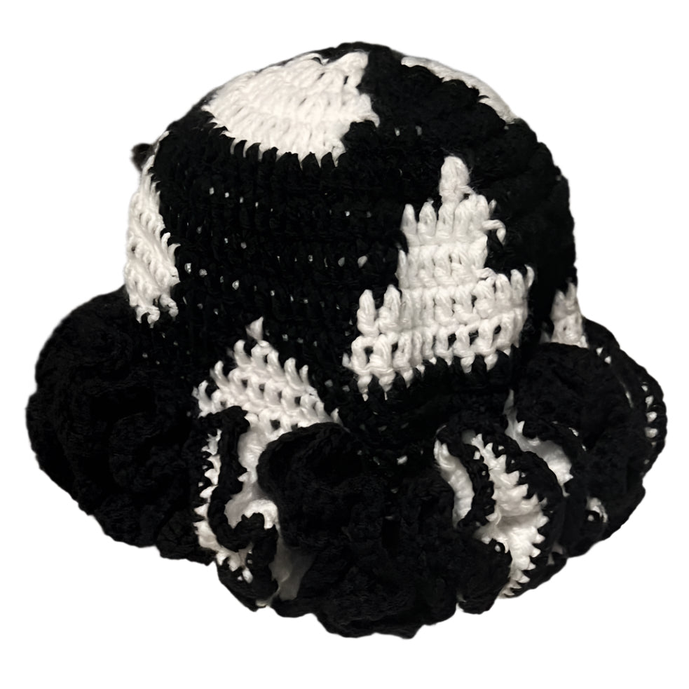 Handmade black and white ruffle hat crocheted with alternating color pattern and decorative ruffled brim