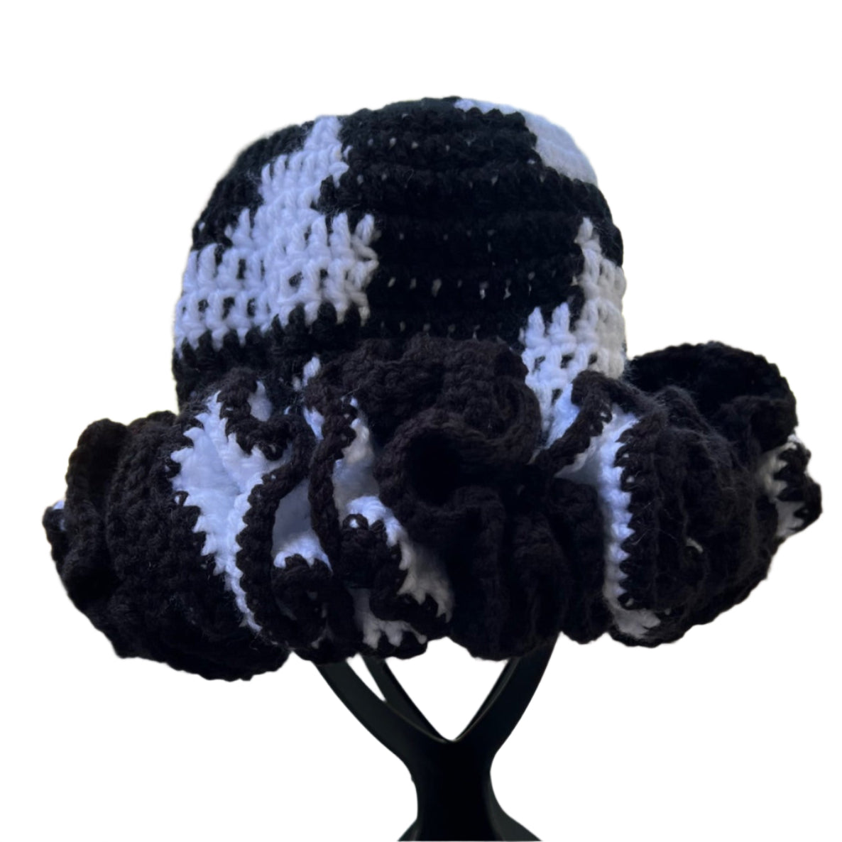 Handmade black and white ruffle hat by ThreadsByHannah with crocheted textured design