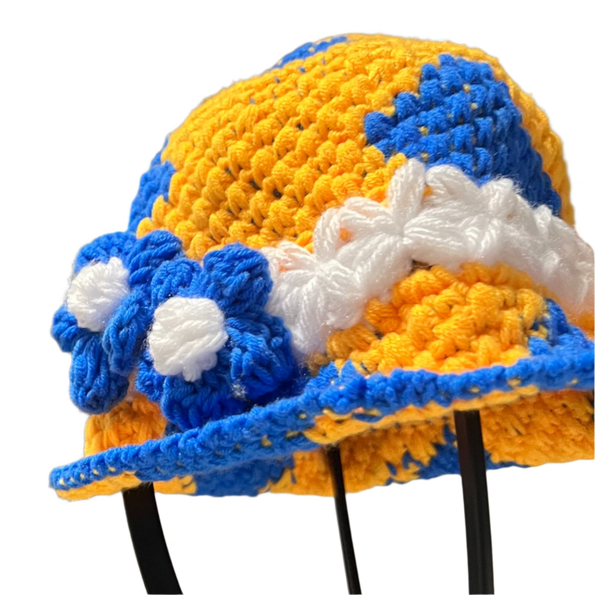 Handmade crochet toddler hat in yellow and blue with white accents and flower details by ThreadsByHannah