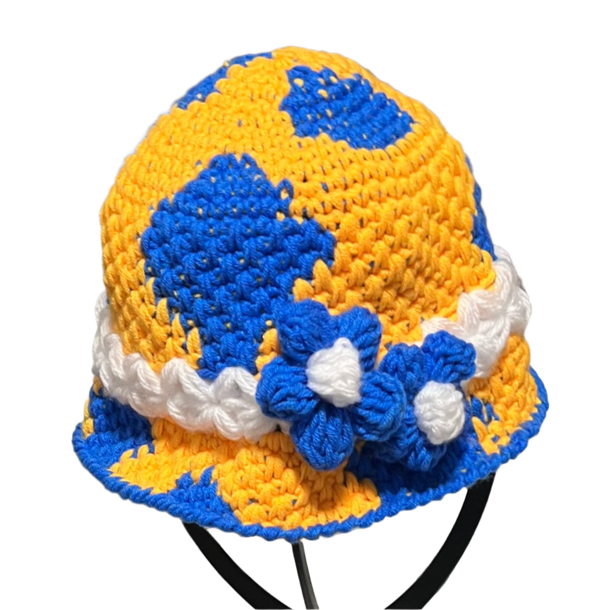 Handmade crochet toddler hat in yellow and blue with white trim and flower accents by ThreadsByHannah