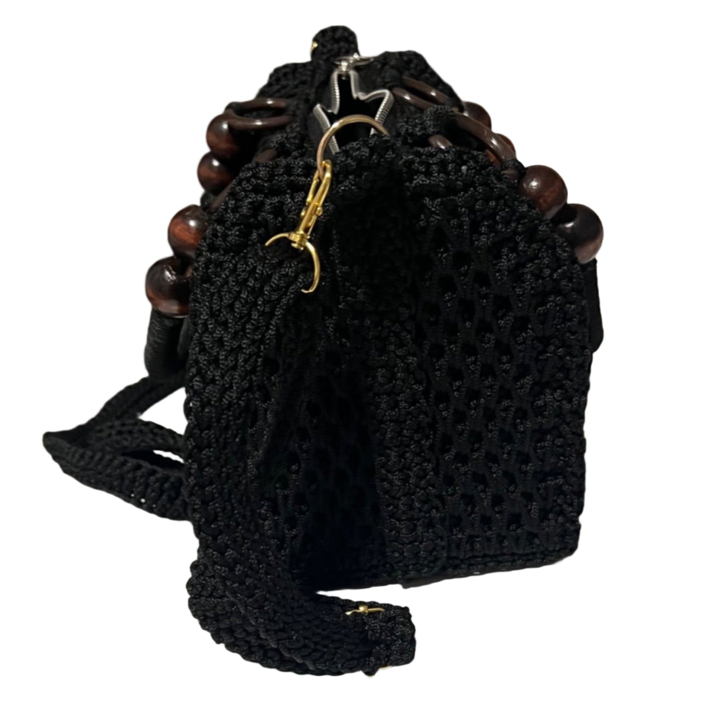 Black African handmade crochet handbag by ThreadsByHannah with wooden bead handle and adjustable shoulder strap