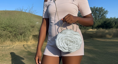 African Handmade Crochet Flower Sling Purse with a floral design and a chain strap, perfect for casual outings.