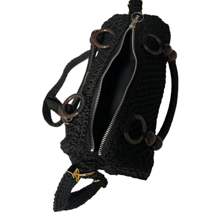 African handmade crochet Sling handbag with unique wooden ring accents and a durable zipper closure