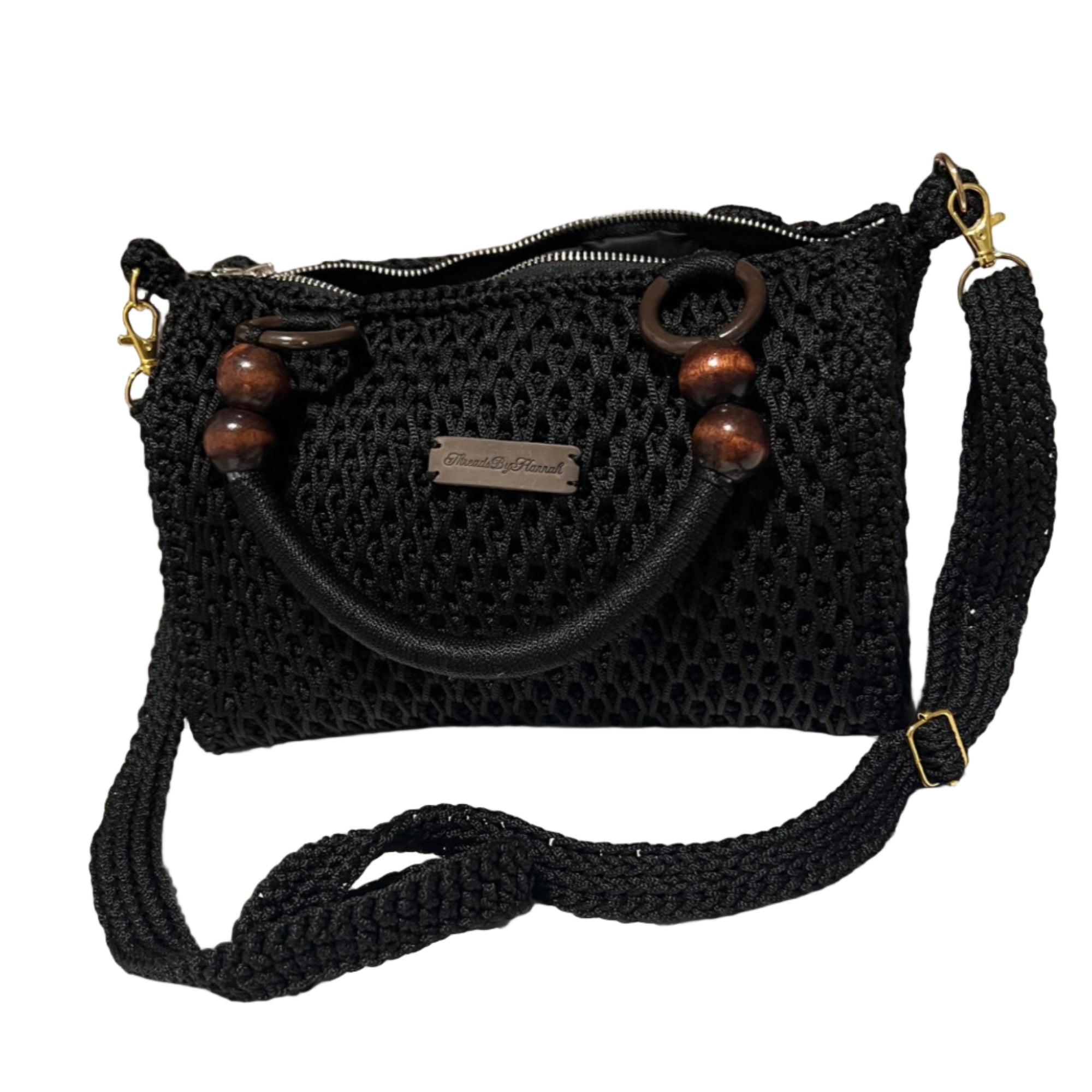 African handmade crochet Sling handbag in black with wooden accents and adjustable strap