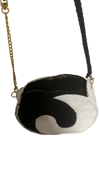 African Handmade Crochet Sling Purse with stylish black and white design and chain strap