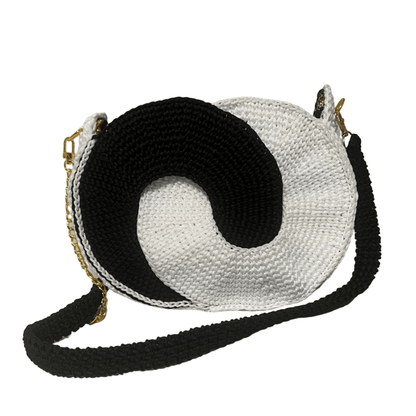 African Handmade Crochet Sling Purse in black and white with a unique spiral design and adjustable strap