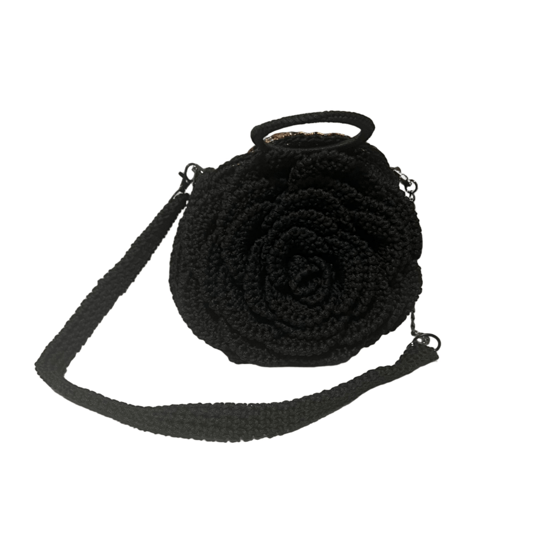 African Handmade Sling Flower Purse in black with a unique floral design and adjustable strap