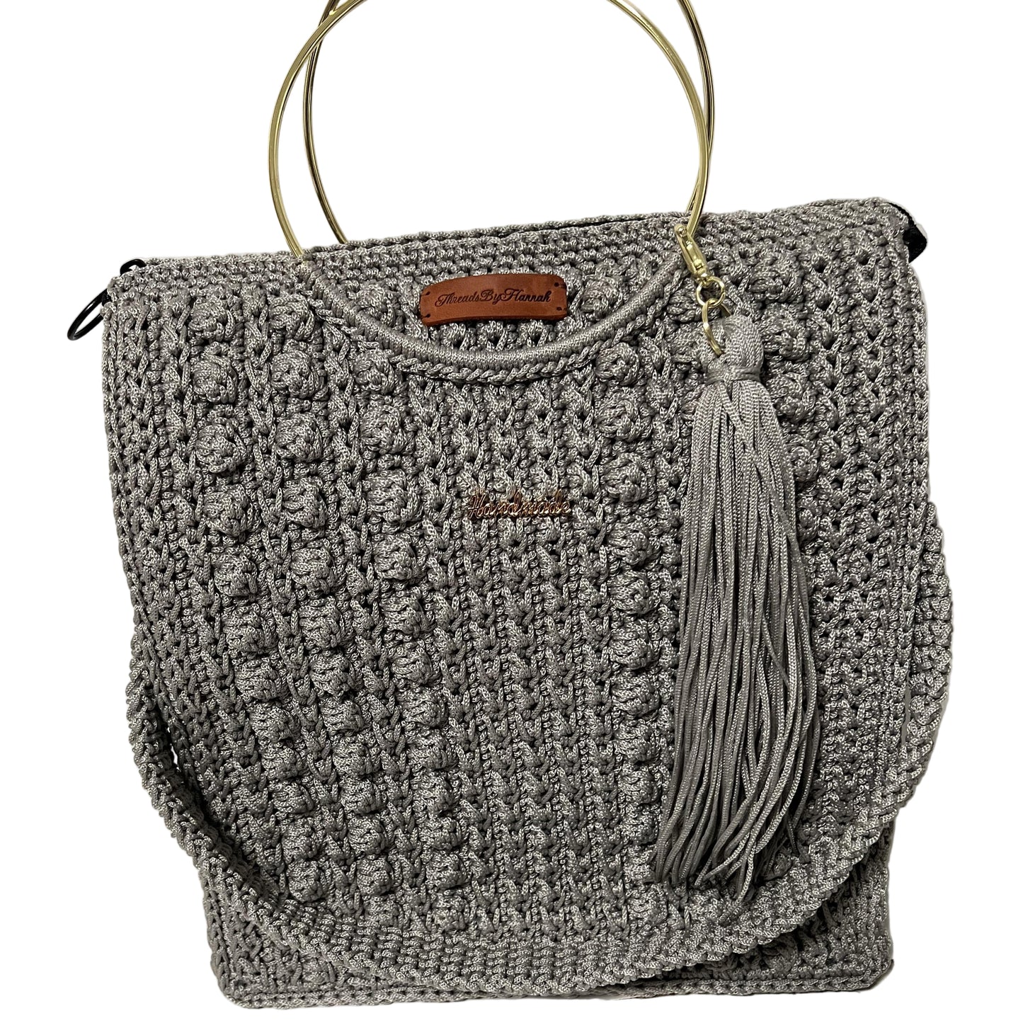 African handmade Trapezoid handbag in gray with tassel and structured design for stylish use