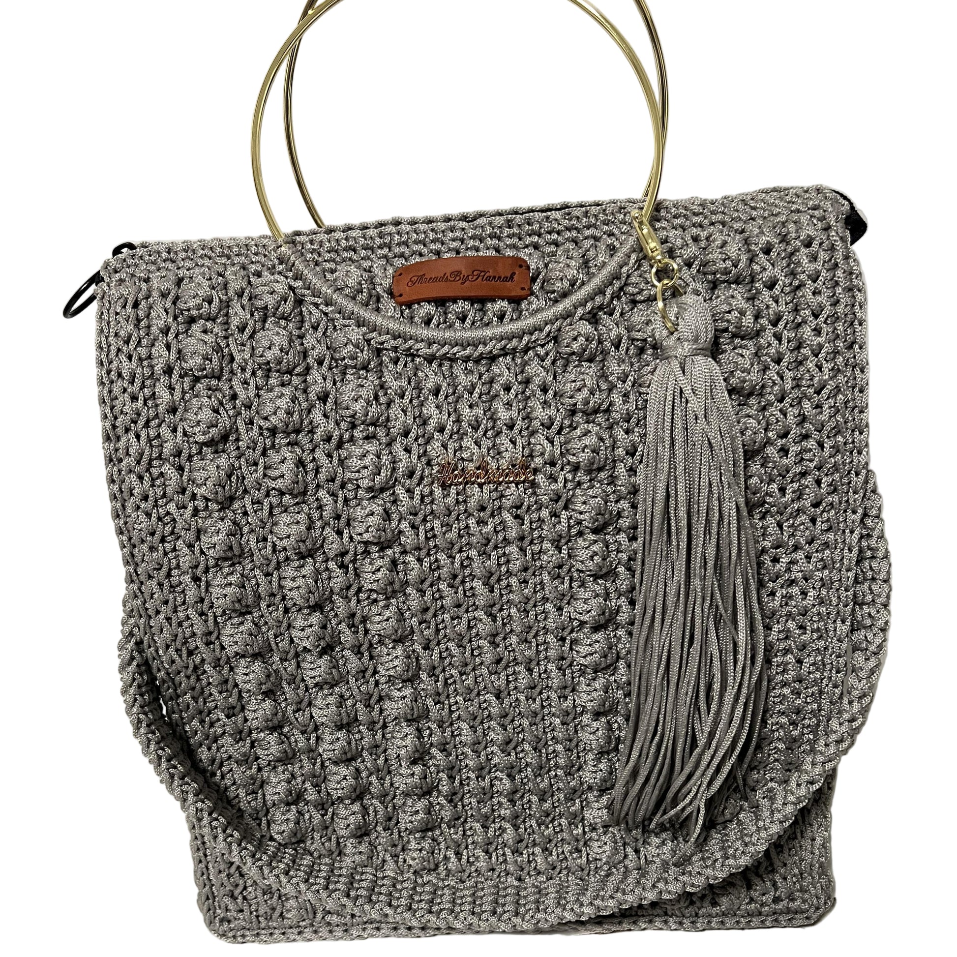 African handmade Trapezoid handbag in gray with tassel and structured design for stylish use
