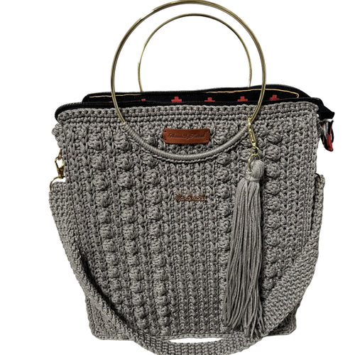 African handmade Trapezoid handbag with a stylish design and gold ring handles