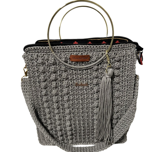 African handmade Trapezoid handbag with a stylish design and gold ring handles