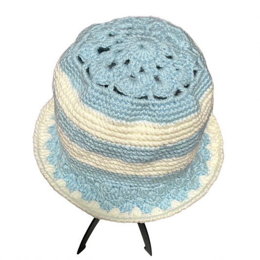 Blue stripe crochet bucket hat by ThreadsByHannah featuring soft textured yarn and a scalloped brim
