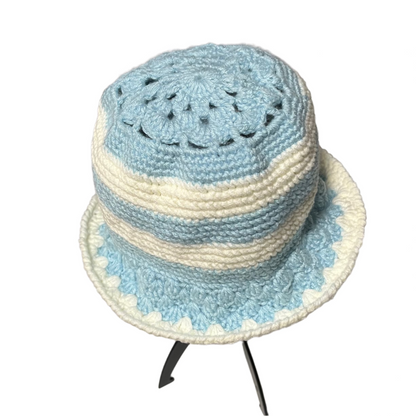 Blue stripe crochet bucket hat by ThreadsByHannah featuring a textured knit pattern and soft brim