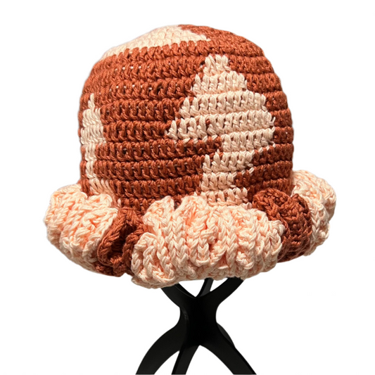 Brown and cream crochet ruffle hat for women with a textured pattern and ruffled brim