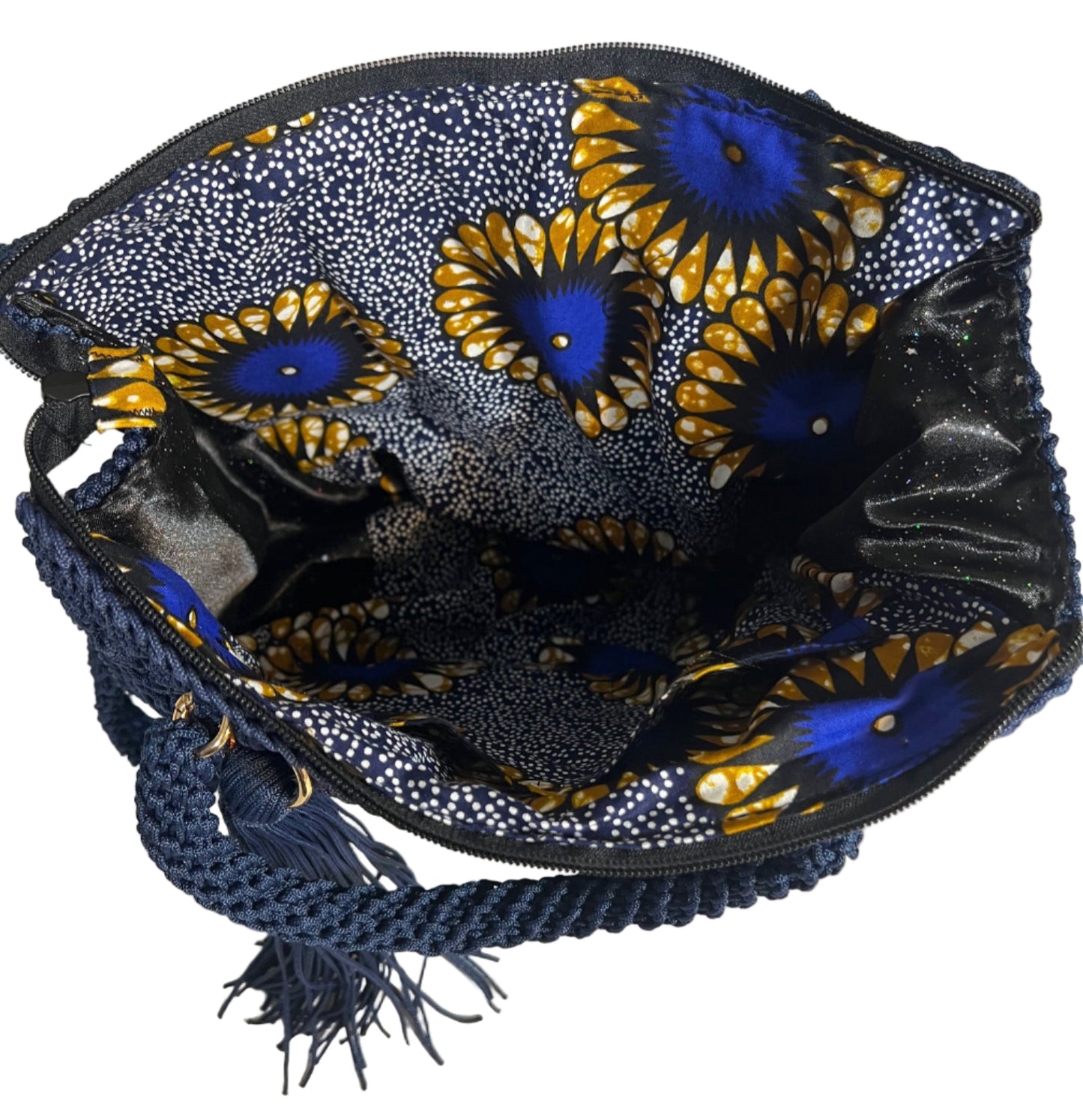 Crochet shoulder bag for women featuring a colorful floral interior and braided strap for stylish convenience