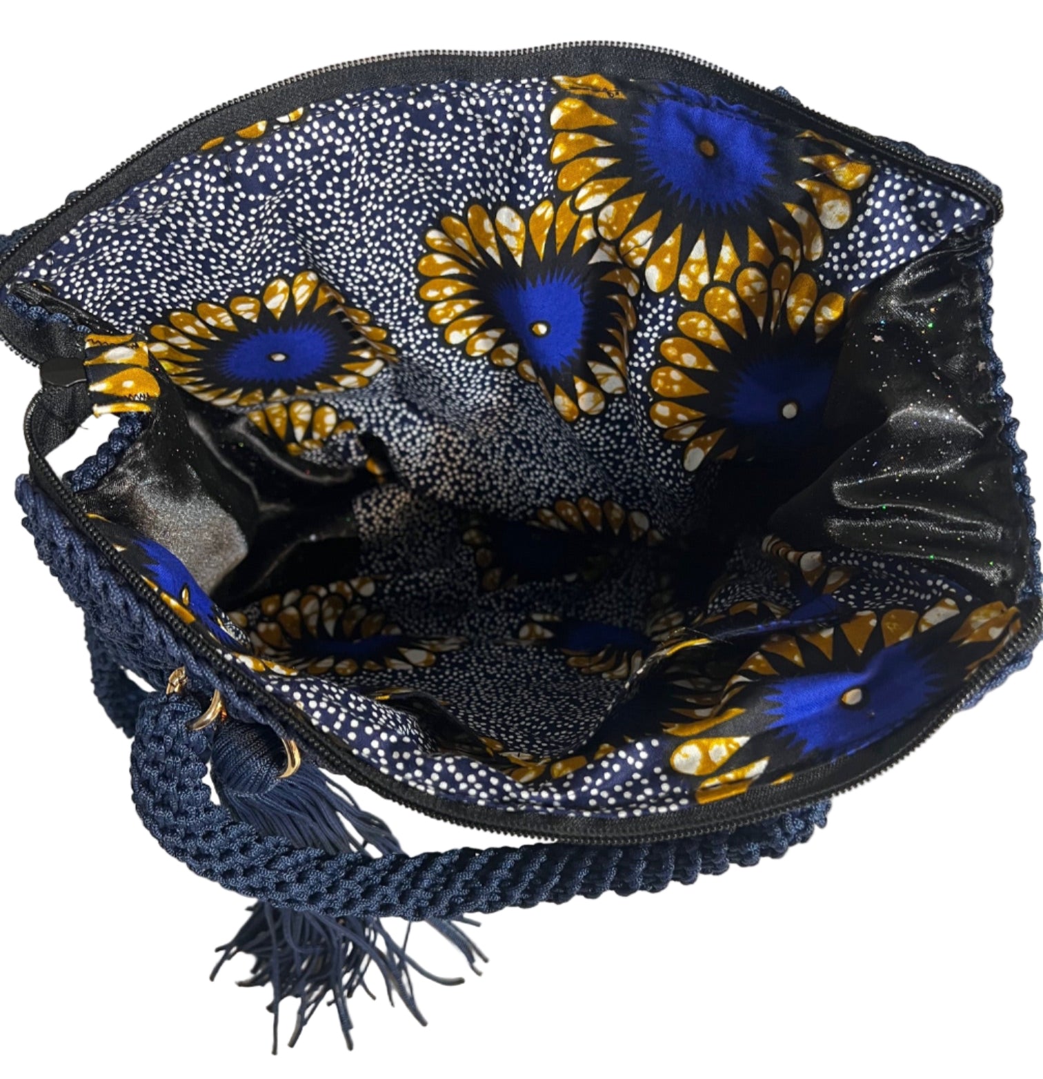 Crochet shoulder bag for women featuring a colorful floral interior and braided strap for stylish convenience