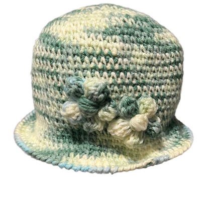 Hand crocheted green and cream flower bucket hat for adults with textured floral design by ThreadsByHannah