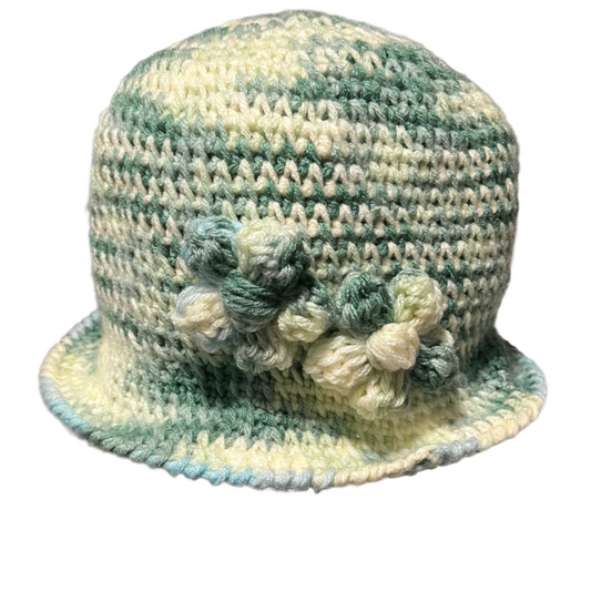 Hand crocheted green and cream flower bucket hat for adults with textured floral design by ThreadsByHannah
