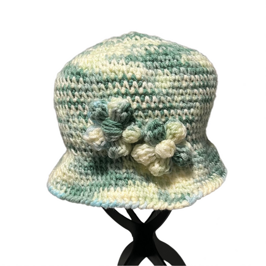 ThreadsByHannah handmade crocheted flower bucket hat for adults in green and cream tones