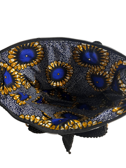 Inside view of a grey crochet shoulder bag for women with vibrant patterned lining