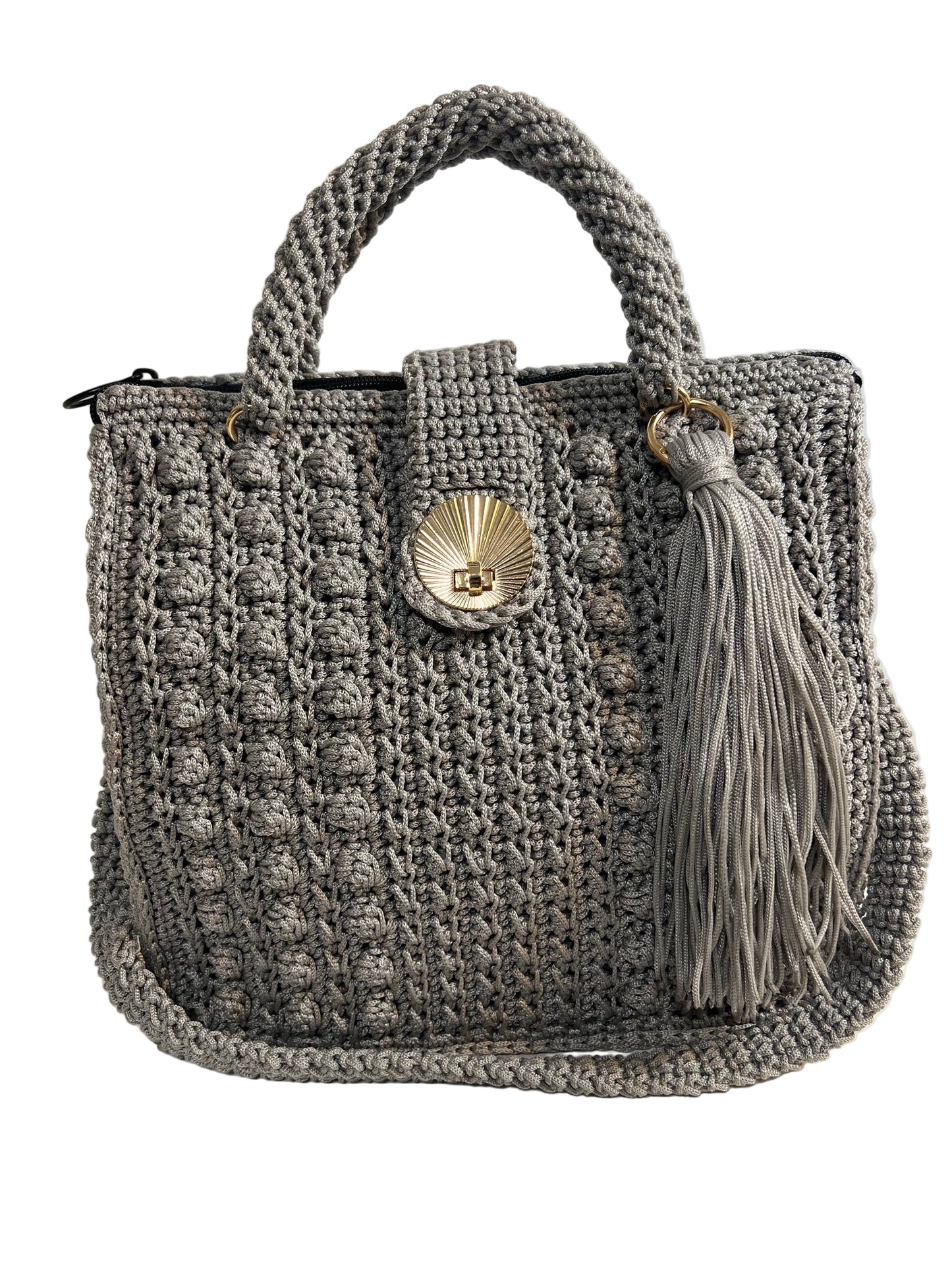 Stylish grey crochet shoulder bag for women with a decorative tassel and unique shell clasp