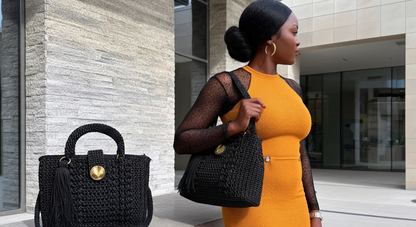 Stylish handcrafted black sling handbag made of woven material, perfect for modern outfits