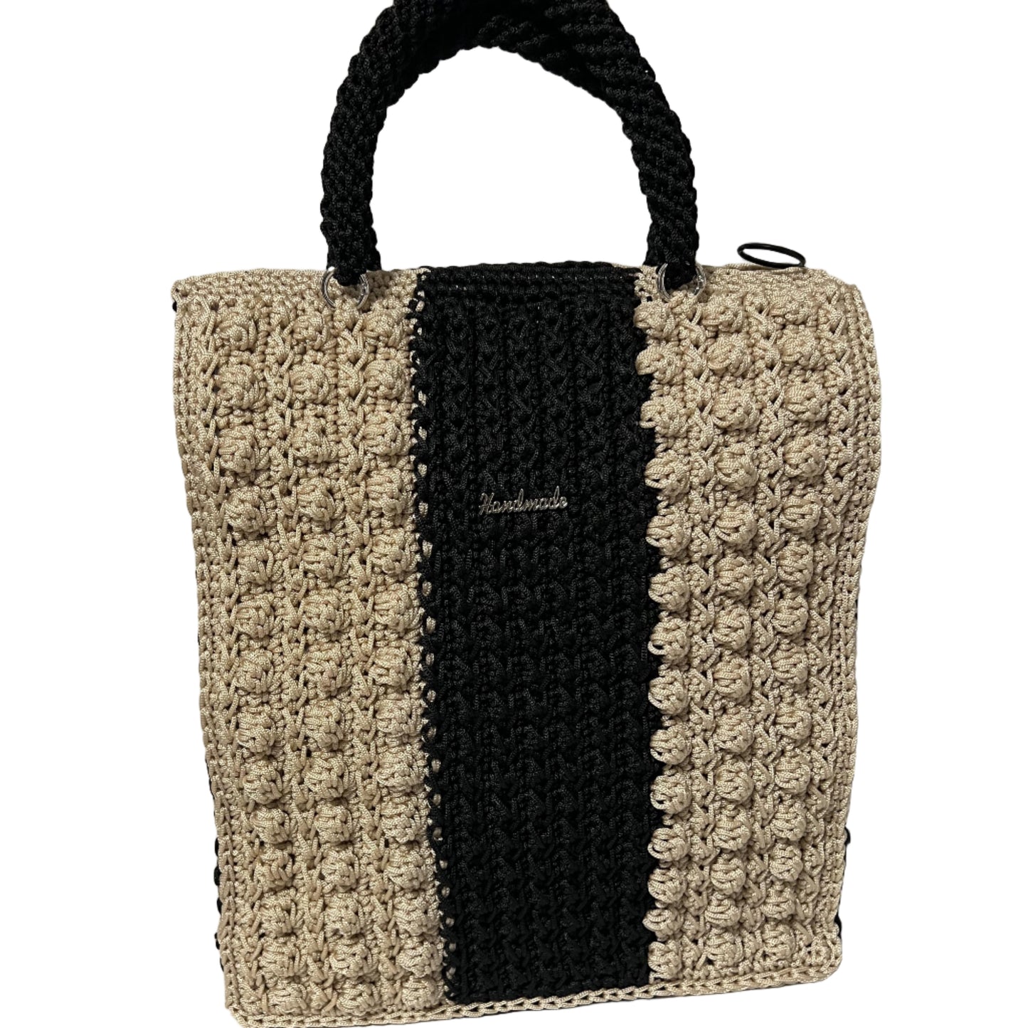 Handcrafted bohemian tote bag in black and beige with textured design and sturdy handles