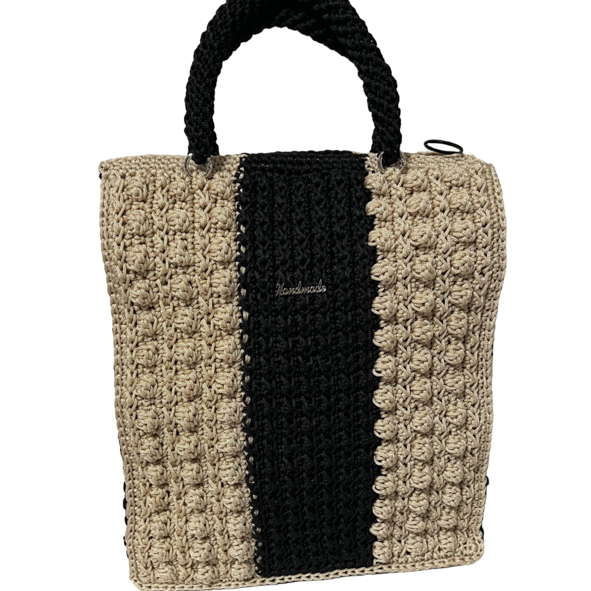 Handcrafted bohemian tote bag in black and beige with textured design and sturdy handles