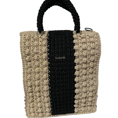 Handcrafted bohemian tote bag in black and beige with textured design and sturdy handles