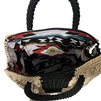 Handcrafted bohemian tote bag with a colorful interior and durable woven design