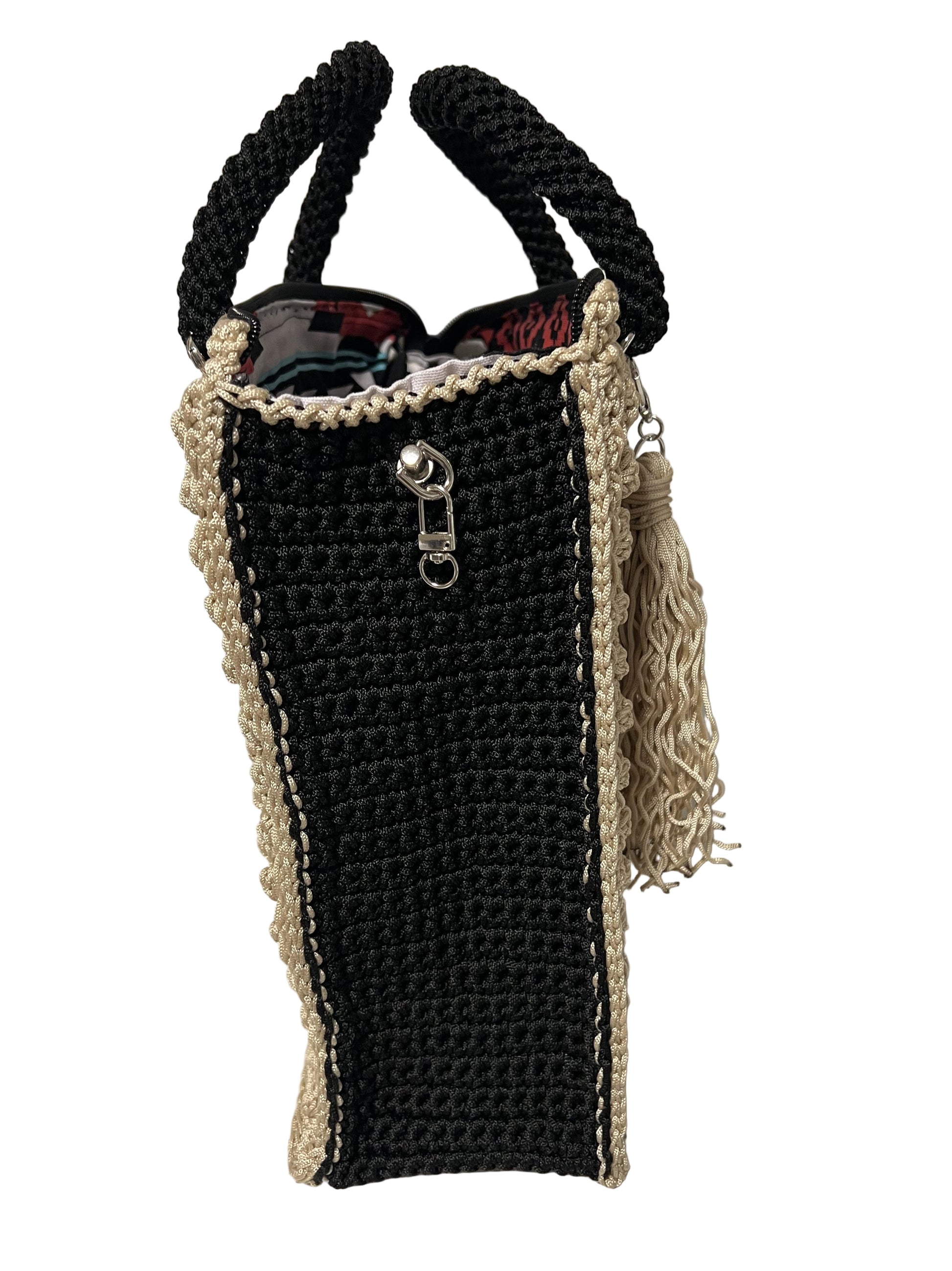 Handcrafted bohemian tote bag with unique trapezoid shape and stylish tassel, perfect for casual outings