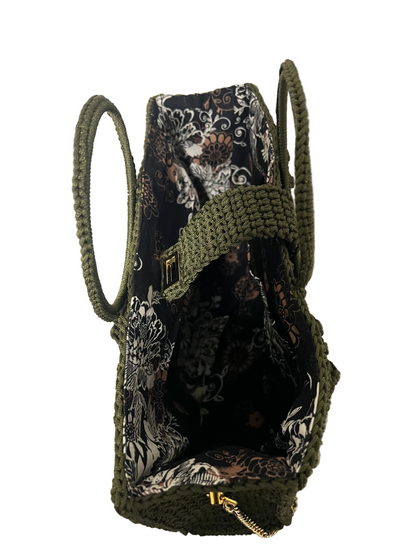 Handcrafted Trapezoid handbag with chain featuring a floral interior and sturdy handles