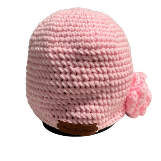 Pink handmade beanie for girls ages 4-10 with crochet flower detail by ThreadsByHannah