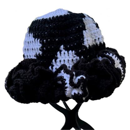 Handmade black and white ruffle hat with crocheted pattern by ThreadsByHannah