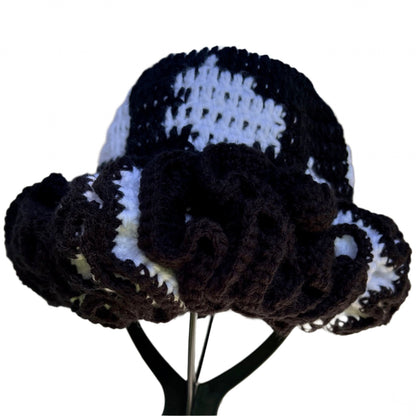 Handmade black and white ruffle hat by ThreadsByHannah with detailed crochet design