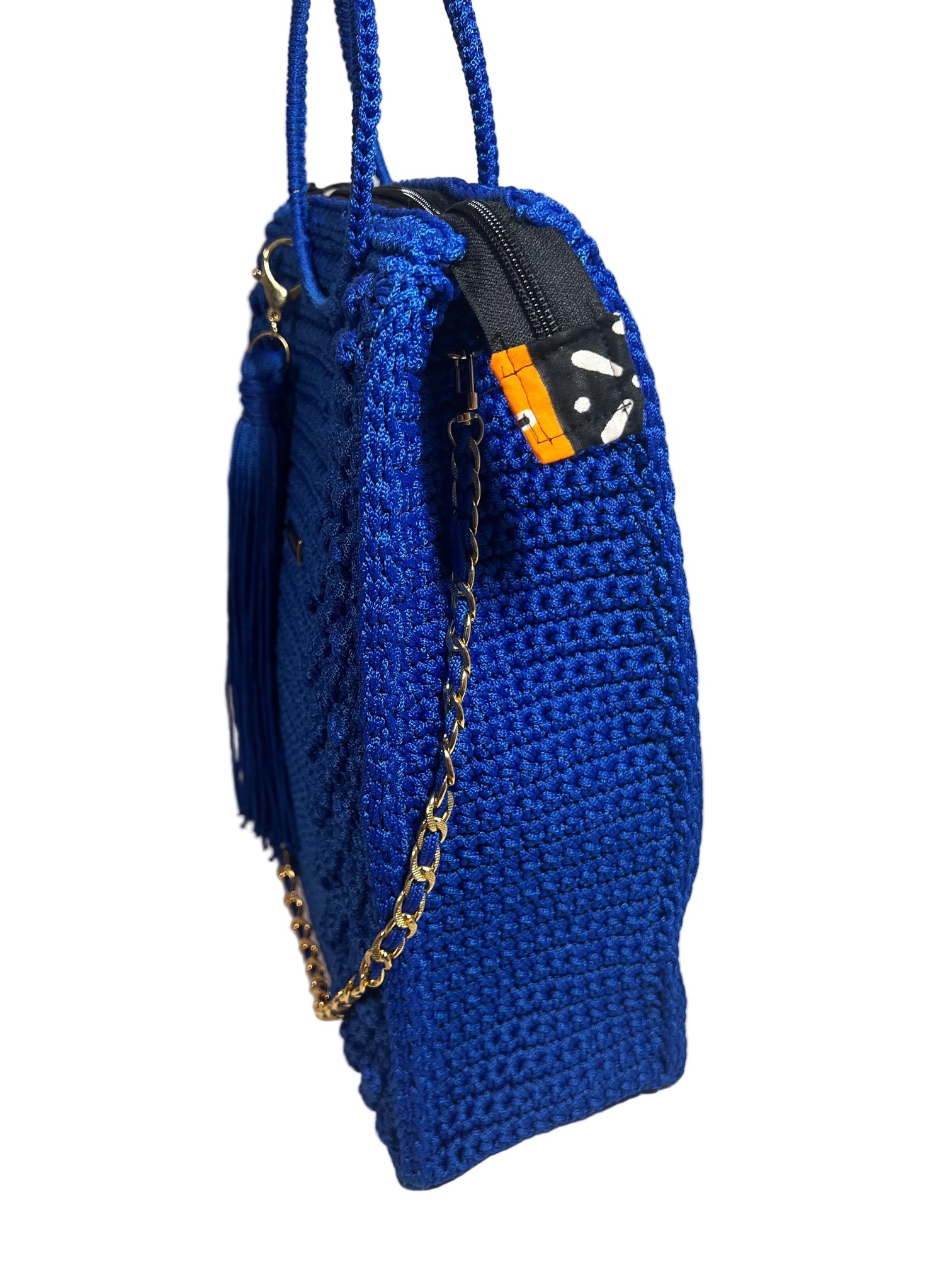 Handmade blue African print handbag with a stylish design and chain detail