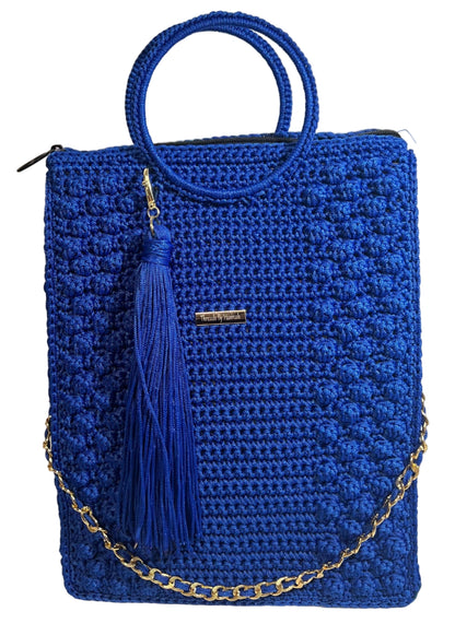 Handmade blue African print handbag with a stylish tassel and gold chain strap