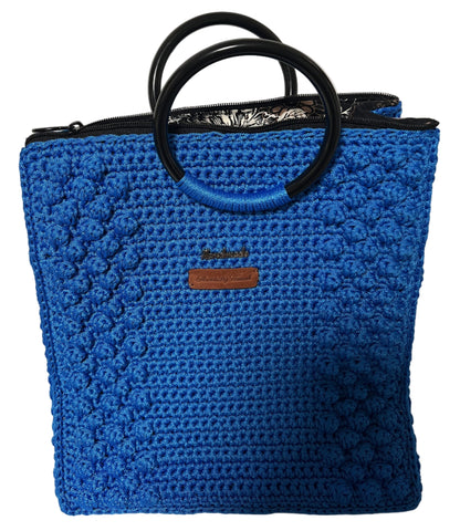 Handmade Blue Crochet Trapezoid Handbag with unique texture and round handles for stylish outings