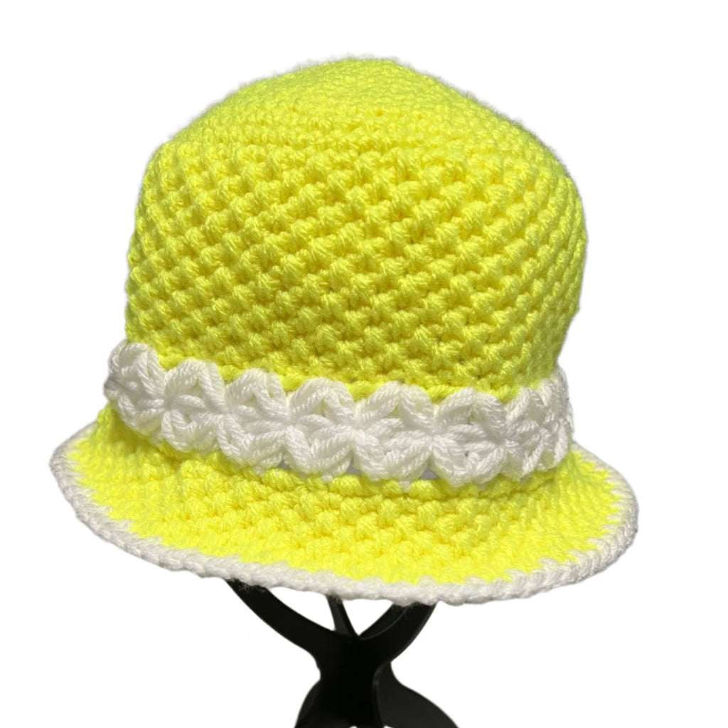 Handmade crochet bucket hat in bright yellow with white floral band and trim by ThreadsByHannah