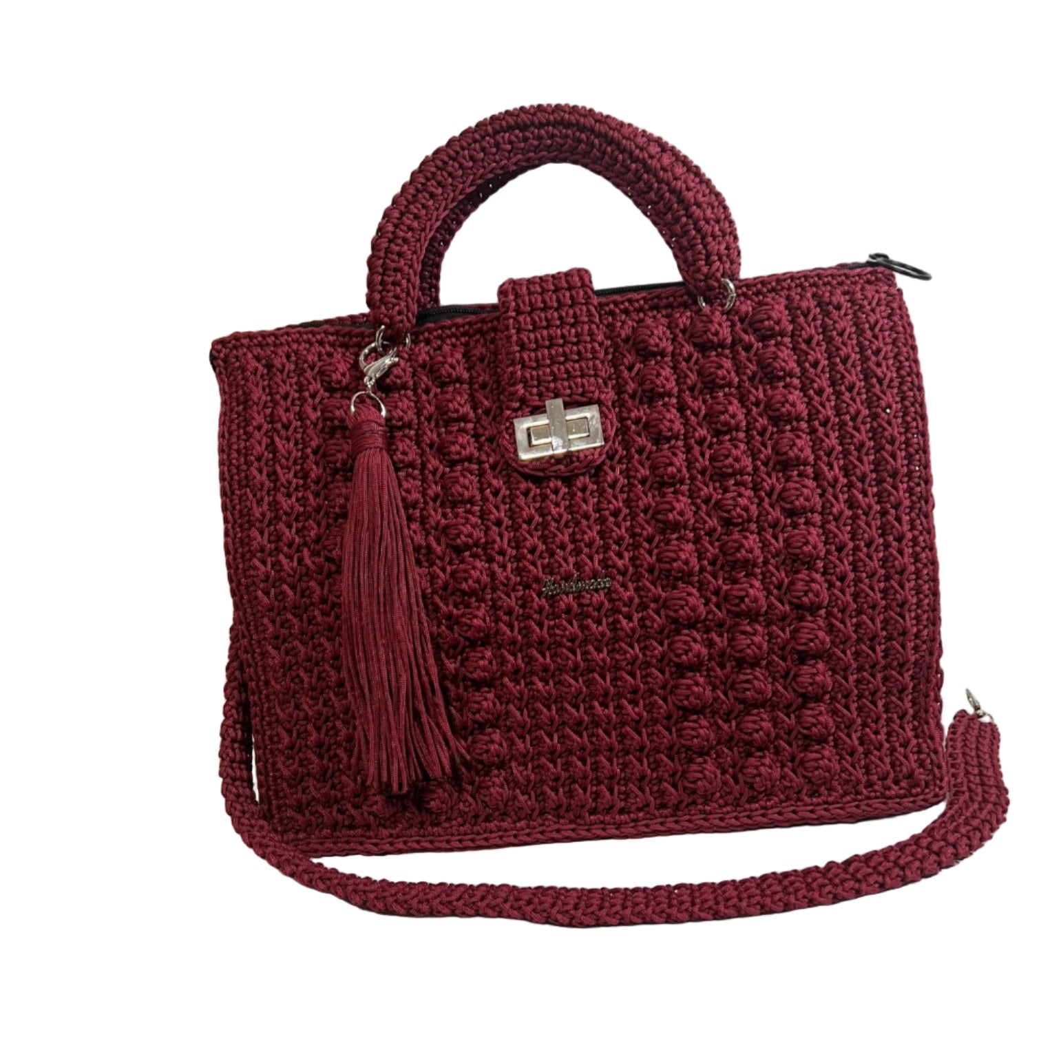 Handmade red sling handbag with braided handle and tassel detail, perfect for stylish outings