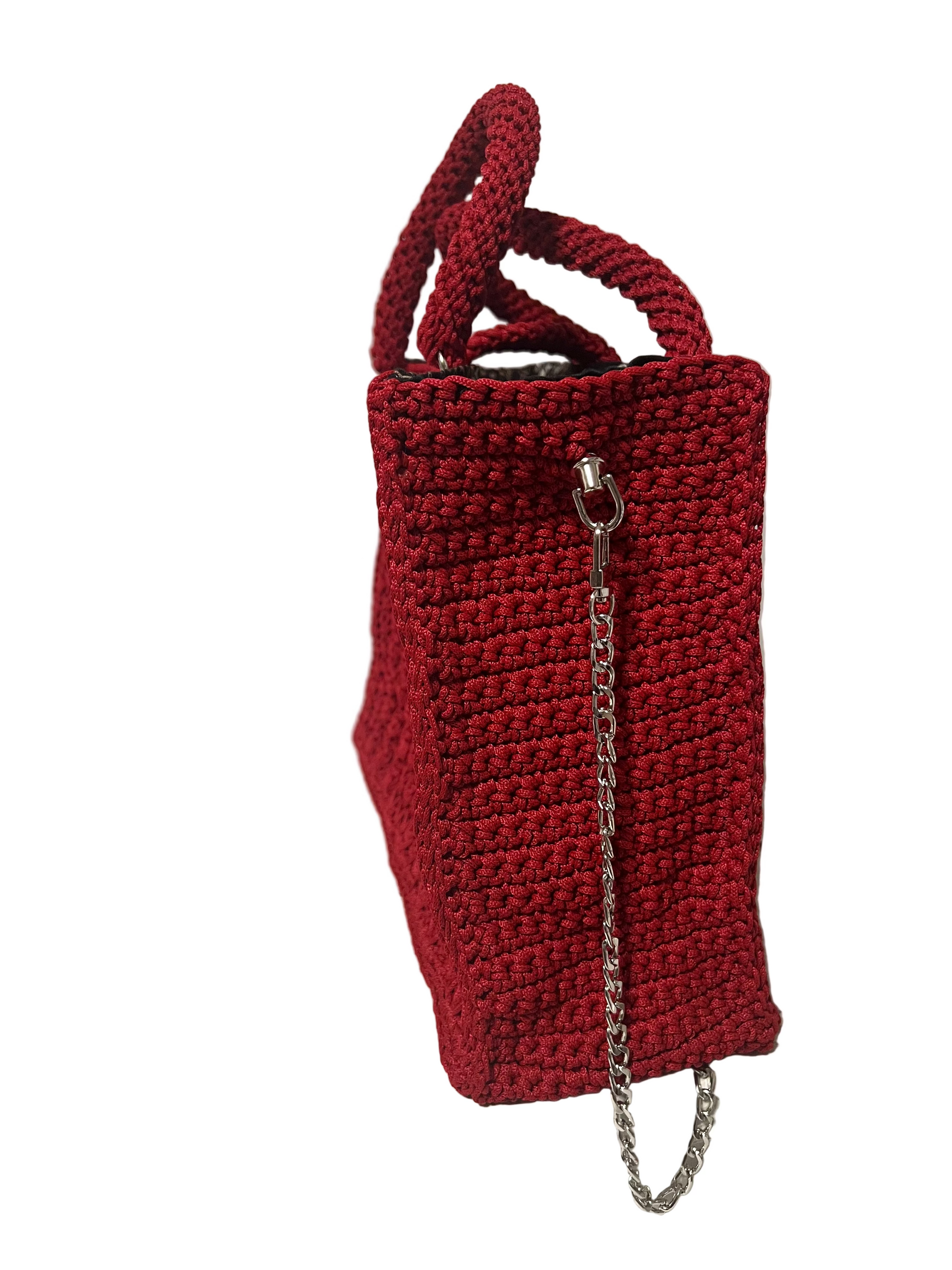 Handmade red Trapezoid handbag with textured design and sturdy chain strap