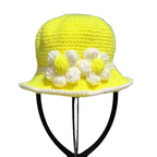 Little Sunshine Baby Crochet Hat in bright yellow with white flower decorations and chin straps