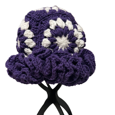 Purple crochet ruffle hat for women with white floral pattern and textured stitch design