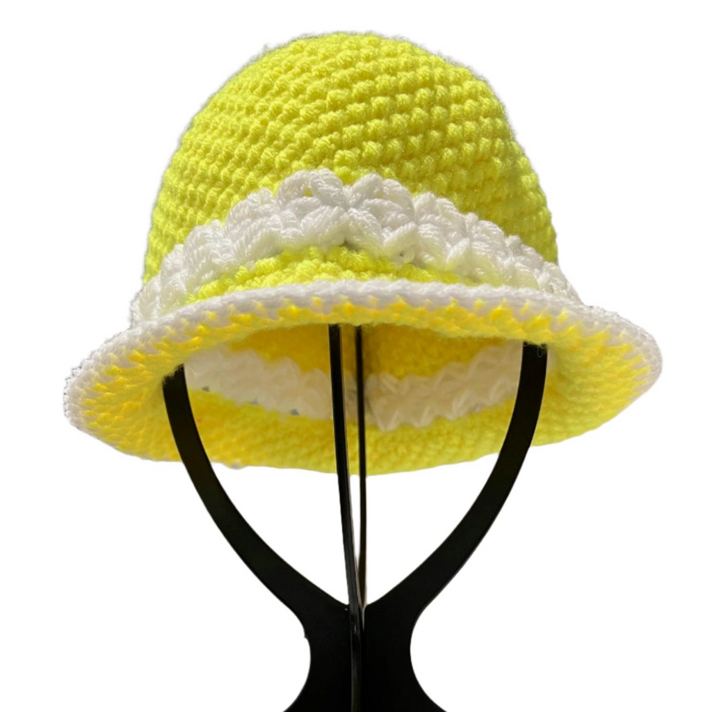 Yellow and white Sunshine Crochet Bucket Hat Handmade displayed on black stand by ThreadsByHannah