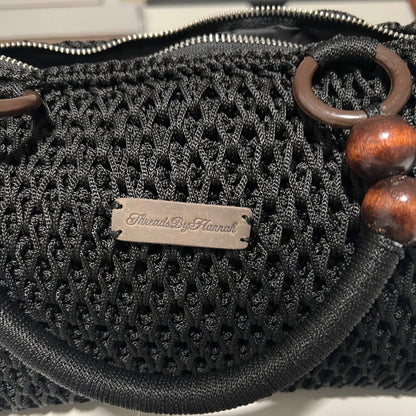 African handmade crochet handbag by ThreadsByHannah black woven purse with wooden bead handles and zipper