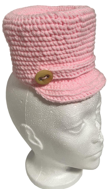 Unique handmade kids winter hat in pink with a button detail for stylish warmth